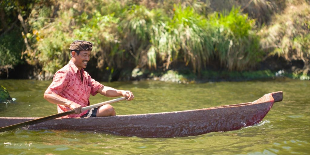 Smiling man on a boat
Cr: Unsplash
